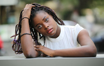 Portrait of young woman sitting at cafe