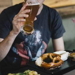 Midsection of man holding ice cream