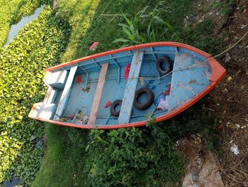 High angle view of abandoned boat on field