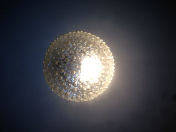 Low angle view of illuminated lamp