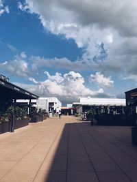 Street amidst buildings against sky