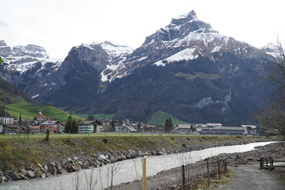 Scenic view of snowcapped mountains against sky