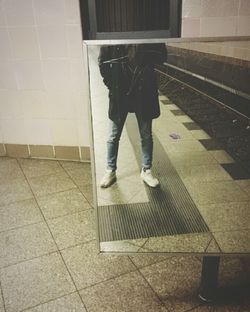 Full length of woman standing on floor