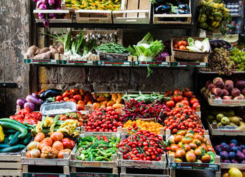 Various fruits and vegetables for sale at market stall