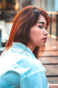 Portrait of young woman looking away