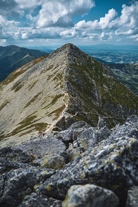 Scenic view of rocks in mountains against sky