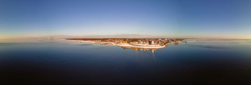 Scenic view of sea against clear blue sky