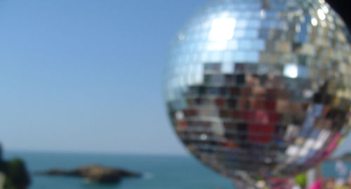 Close-up of reflection of water in sea against clear sky