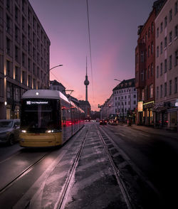 Tramway on road against sky during sunset