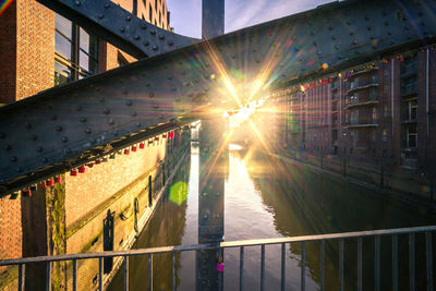 Bridge over canal during sunset