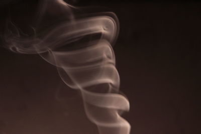 Close-up of smoke against black background