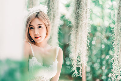 Portrait of young woman wearing mask