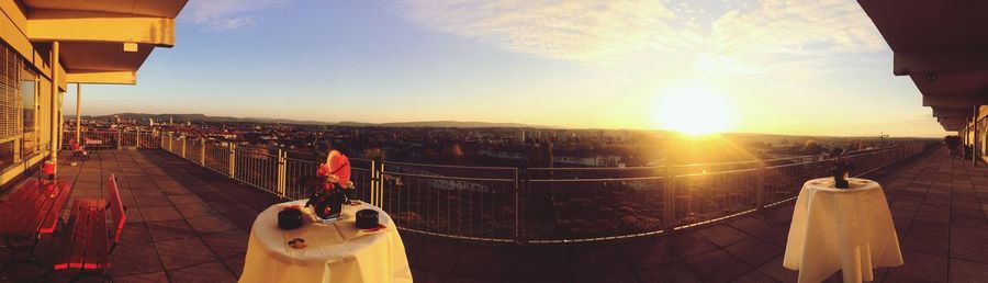 Panoramic view of city against sky during sunset