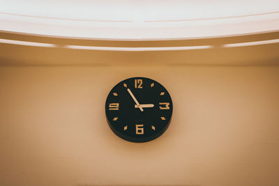 Close-up of clock on wall