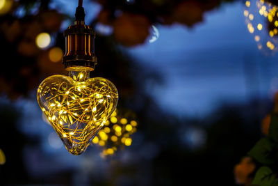 Close-up of illuminated electric lamp