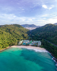 Scenic view of swimming pool by sea against sky