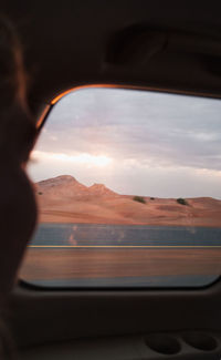 Scenic view of mountains seen through car window