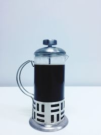 Close-up of coffee cup against white background