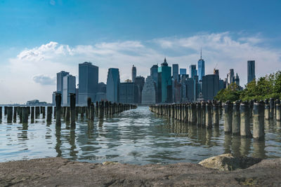 View of skyscrapers against cloudy sky