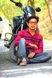 Portrait of young man sitting outdoors