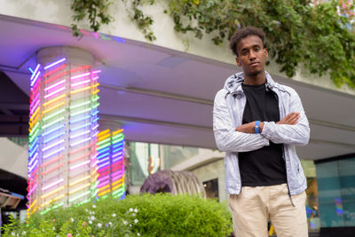 Portrait of young man standing outdoors