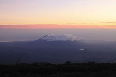 Scenic view of silhouette mountain against sky during sunset