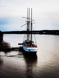 Sailboat sailing in sea against sky