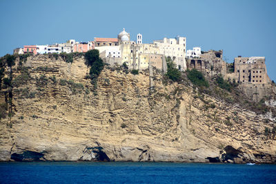 View of sea and buildings against sky