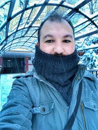 Portrait of smiling man in snow