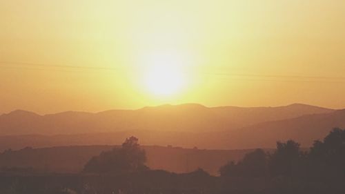 Scenic view of silhouette landscape against sky during sunset