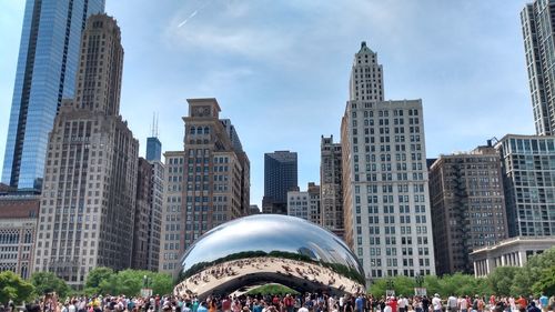 The bean and buildings in city against sky 