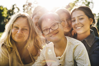 Close-up portrait of smiling family at park