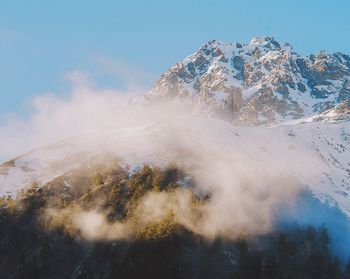 Snow covered mountain against sky