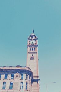 Low angle view of building against clear blue sky