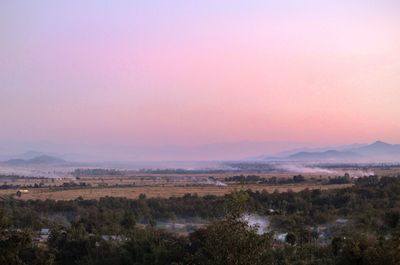 Scenic view of landscape against sky during sunset