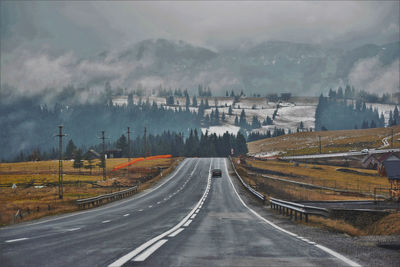 Panoramic view of road against sky during rainy season