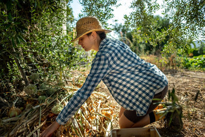 Side view of senior woman in farm