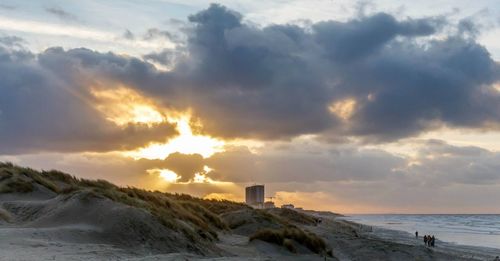 Scenic view of sea against cloudy sky