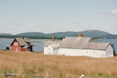 Farm house on field against sky