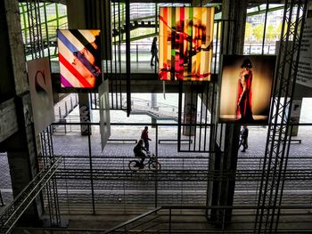 Side view of people walking in city