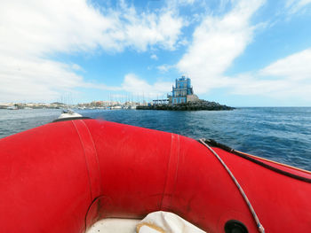 View of ship in sea against cloudy sky