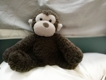 Close-up of stuffed toy on bed