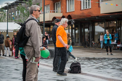 People walking on street in city