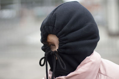 Rear view of woman with umbrella