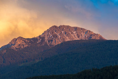 Scenic view of mountain against sky during sunset