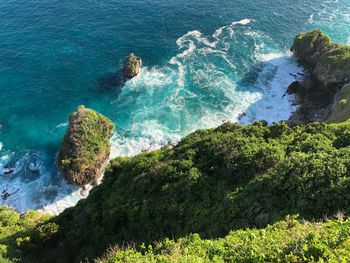 High angle view of sea by cliff