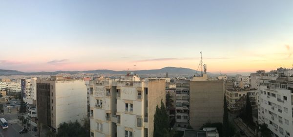 High angle view of buildings against sky during sunset