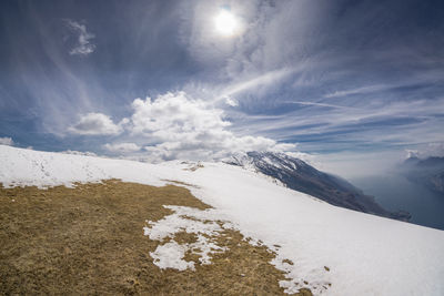 Scenic view of snowcapped mountains against sky