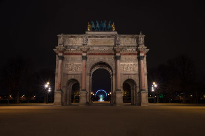 Low angle view of arc de triomphe du carrousel at night