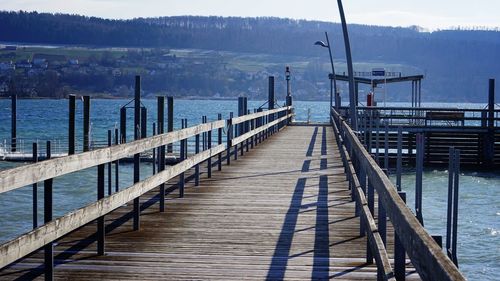 Pier over sea against sky